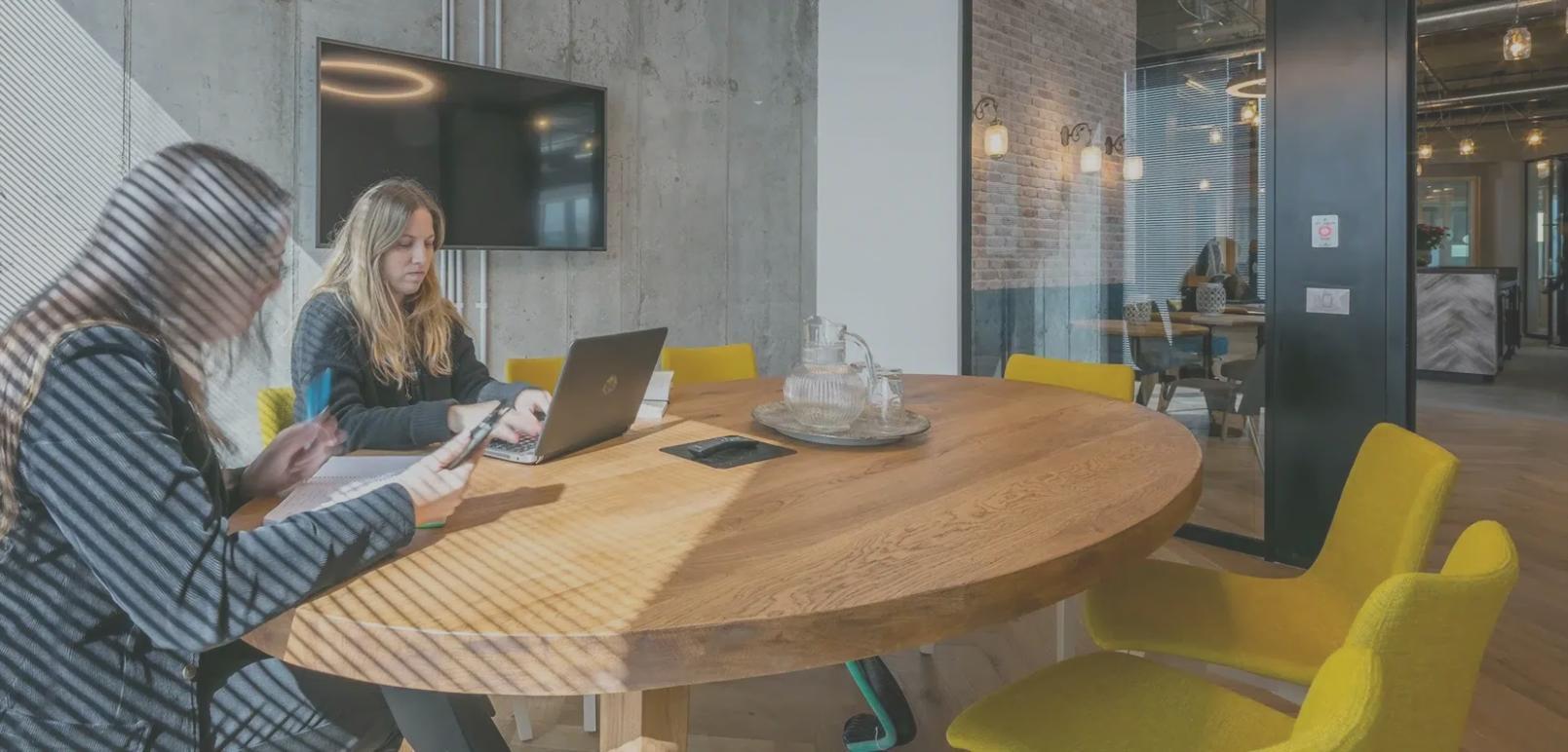 Person taking a mindful break from remote work with coffee and notebook